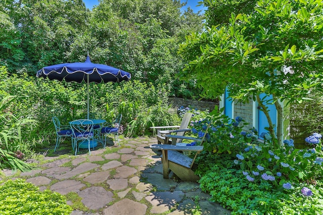 260 Bradford St, Provincetown, MA 02657 - view of patio featuring an outbuilding and outdoor dining space