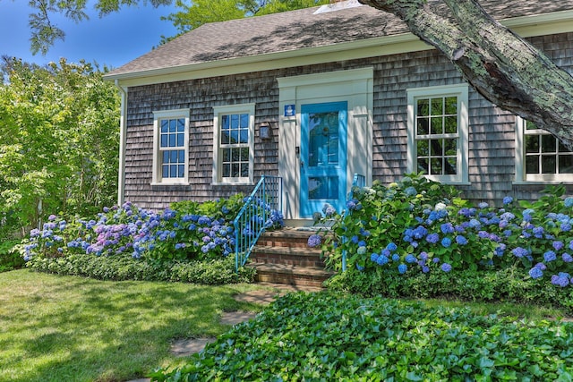 260 Bradford St, Provincetown, MA 02657 - doorway to property with a shingled roof and a yard