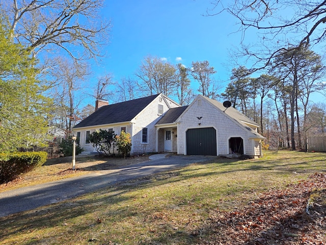 view of front facade with a garage and a front yard