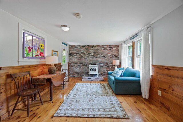 1079 State Hwy Unit 14, Eastham, MA 02642 - living area with light wood-style floors and a wood stove