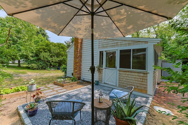 1079 State Hwy Unit 14, Eastham, MA 02642 - view of patio with a garden and an outdoor structure