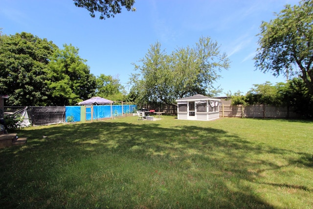 72 Grove St, Hyannis, MA 02601 - fenced backyard with a sunroom