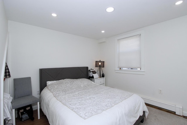 72 Grove St, Hyannis, MA 02601 - bedroom featuring a baseboard heating unit, recessed lighting, and wood finished floors