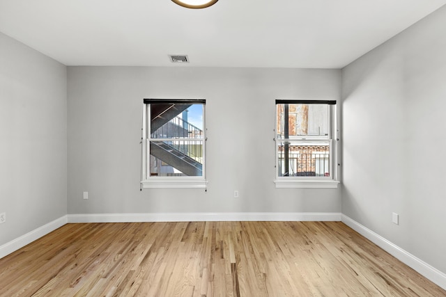 877 Harrison Ave, Boston, MA 02118 - spare room featuring a healthy amount of sunlight, baseboards, visible vents, and wood finished floors