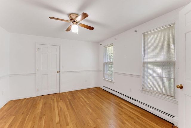 100 Potonumecot Rd, Chatham, MA 02633 - empty room featuring a baseboard radiator, light wood finished floors, a ceiling fan, and baseboards