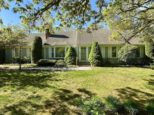 100 Potonumecot Rd, Chatham, MA 02633 - view of front of home featuring a front lawn and a chimney