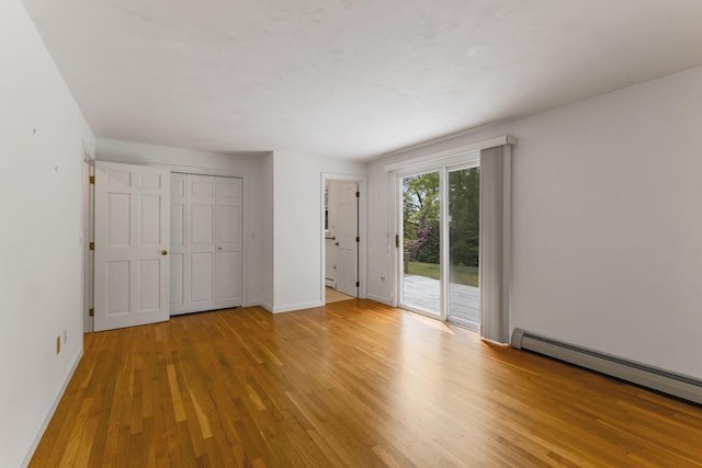 100 Potonumecot Rd, Chatham, MA 02633 - unfurnished bedroom featuring access to exterior, a baseboard heating unit, light wood finished floors, and baseboards