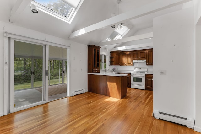 100 Potonumecot Rd, Chatham, MA 02633 - kitchen with white range with gas cooktop, a skylight, baseboard heating, a baseboard heating unit, and under cabinet range hood