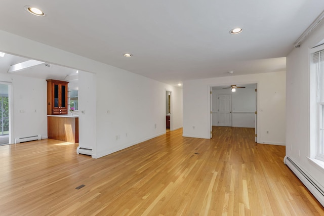 100 Potonumecot Rd, Chatham, MA 02633 - unfurnished living room with a baseboard heating unit, light wood-style flooring, recessed lighting, and ceiling fan