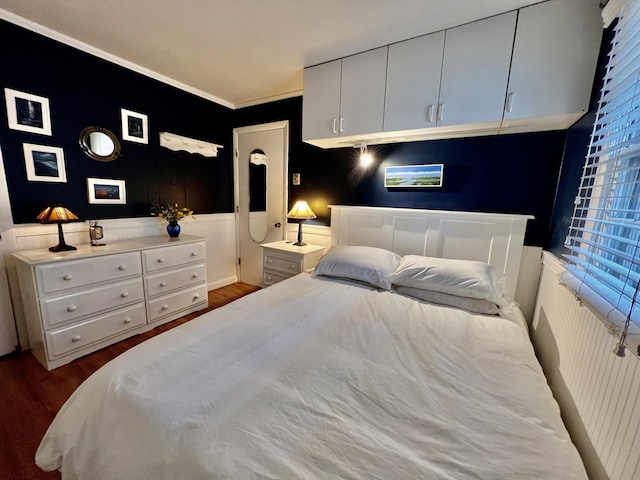 3 Winthrop St Unit U1, Provincetown, MA 02657 - bedroom with wood finished floors, wainscoting, and crown molding