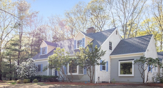 1118 Bumps River Rd, Centerville, MA 02632 - view of front facade featuring a chimney and roof with shingles