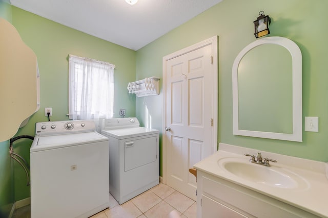 1118 Bumps River Rd, Centerville, MA 02632 - laundry room with separate washer and dryer and light tile patterned flooring