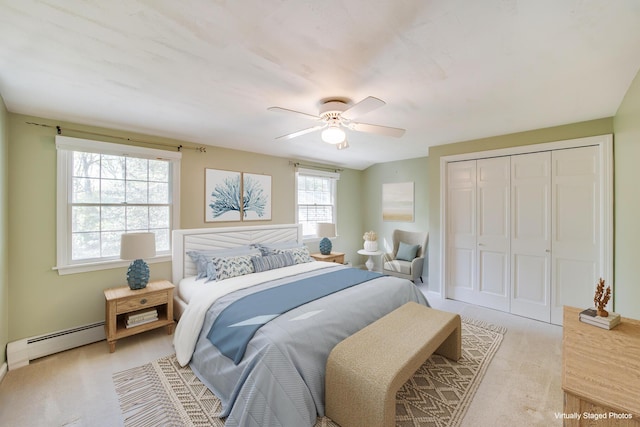 1118 Bumps River Rd, Centerville, MA 02632 - bedroom featuring a baseboard heating unit, a closet, ceiling fan, and light carpet