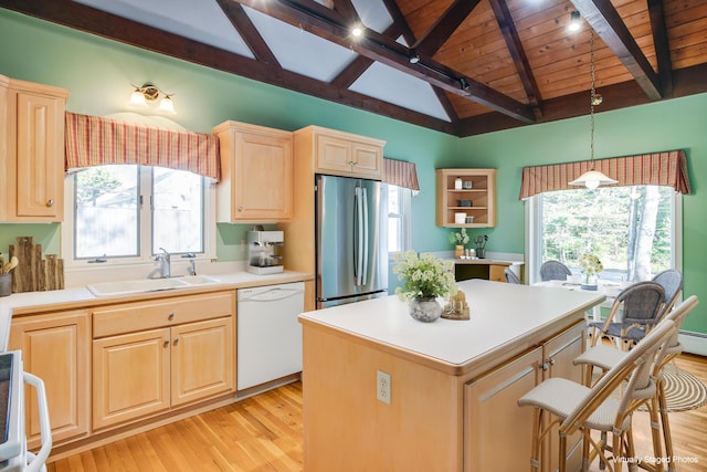 1118 Bumps River Rd, Centerville, MA 02632 - kitchen with dishwasher, freestanding refrigerator, a sink, light wood-style flooring, and light brown cabinetry