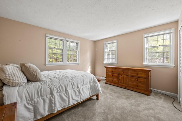 154 Cotuit Bay Dr, Cotuit, MA 02635 - bedroom featuring baseboards, carpet flooring, and baseboard heating