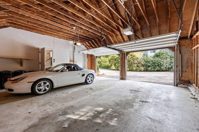 154 Cotuit Bay Dr, Cotuit, MA 02635 - garage featuring a garage door opener