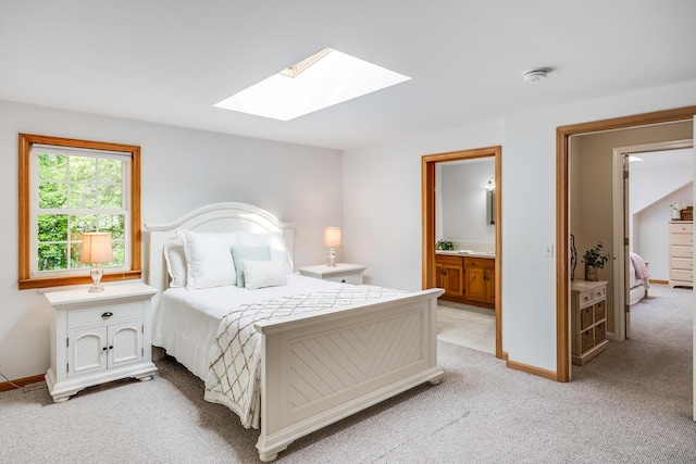 7 Liberty Pl, East Dennis, MA 02641 - bedroom featuring a skylight, light colored carpet, connected bathroom, and baseboards