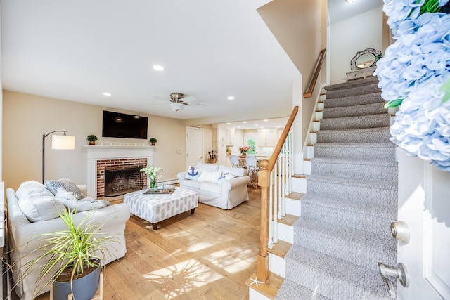 7 Liberty Pl, East Dennis, MA 02641 - living room with stairs, ceiling fan, light wood-type flooring, a fireplace, and recessed lighting