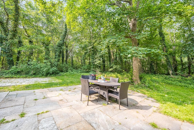 7 Liberty Pl, East Dennis, MA 02641 - view of patio / terrace with outdoor dining space and a forest view