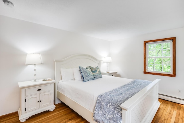 7 Liberty Pl, East Dennis, MA 02641 - bedroom featuring light wood-style flooring, baseboard heating, and baseboards