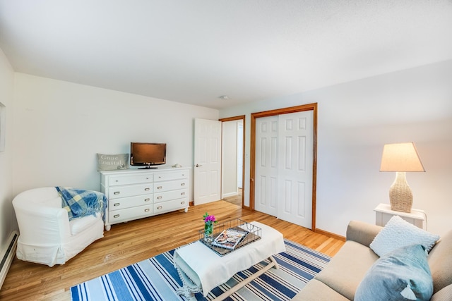 7 Liberty Pl, East Dennis, MA 02641 - living room featuring light wood finished floors, a baseboard heating unit, and baseboards
