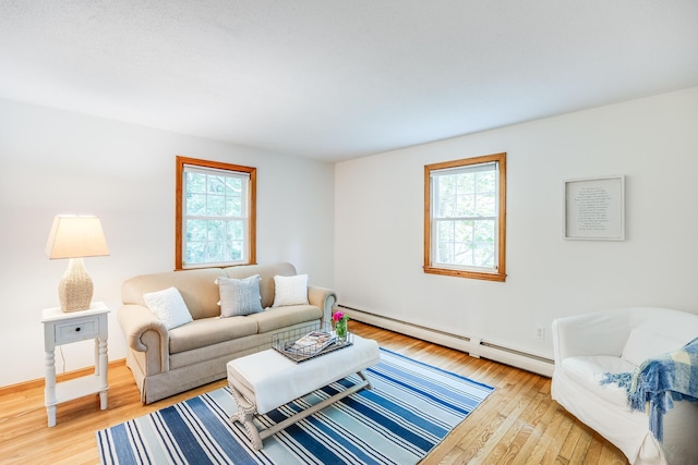 7 Liberty Pl, East Dennis, MA 02641 - living room featuring plenty of natural light, light wood-style floors, baseboard heating, and baseboards