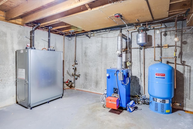 7 Liberty Pl, East Dennis, MA 02641 - unfinished below grade area with a water pressure tank, a heating unit, and fridge