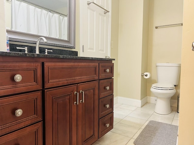 bathroom with walk in shower, toilet, tile patterned floors, and vanity