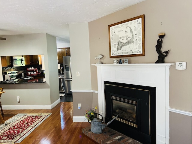 living room featuring dark wood-type flooring