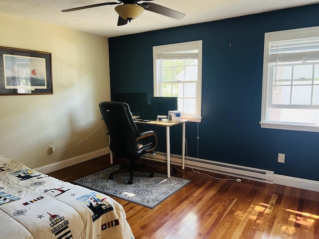 bedroom with wood-type flooring and ceiling fan