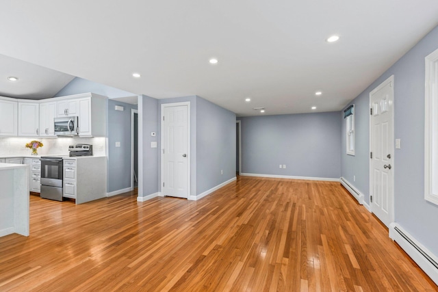 97 Great Western Rd, Harwich, MA 02645 - unfurnished living room with recessed lighting, a baseboard radiator, a baseboard heating unit, and light wood-type flooring