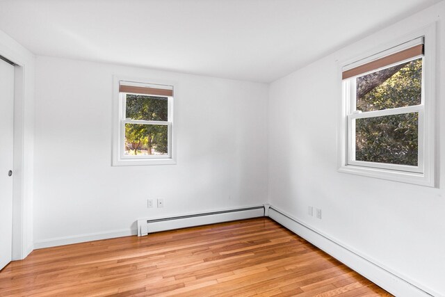 97 Great Western Rd, Harwich, MA 02645 - unfurnished room featuring plenty of natural light, a baseboard radiator, a baseboard heating unit, and light wood-type flooring