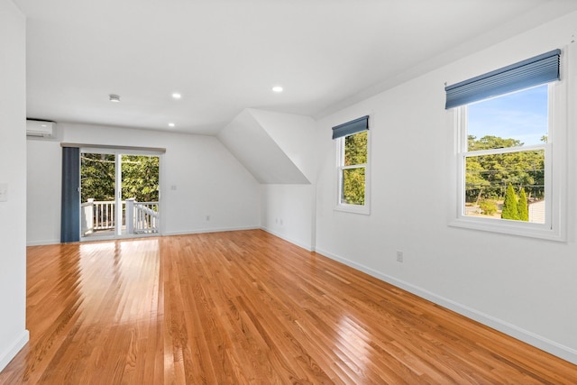 97 Great Western Rd, Harwich, MA 02645 - bonus room with baseboards, a wall unit AC, a wealth of natural light, and light wood-type flooring