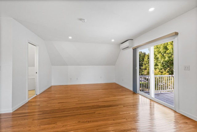 97 Great Western Rd, Harwich, MA 02645 - bonus room featuring an AC wall unit, baseboards, light wood finished floors, and lofted ceiling