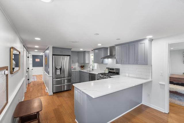 13 Old Fields Rd, Sandwich, MA 02563 - kitchen with appliances with stainless steel finishes, wall chimney range hood, gray cabinets, a peninsula, and light stone counters