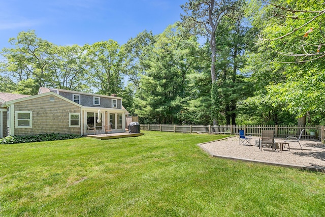 13 Old Fields Rd, Sandwich, MA 02563 - fenced backyard with a deck and a patio area