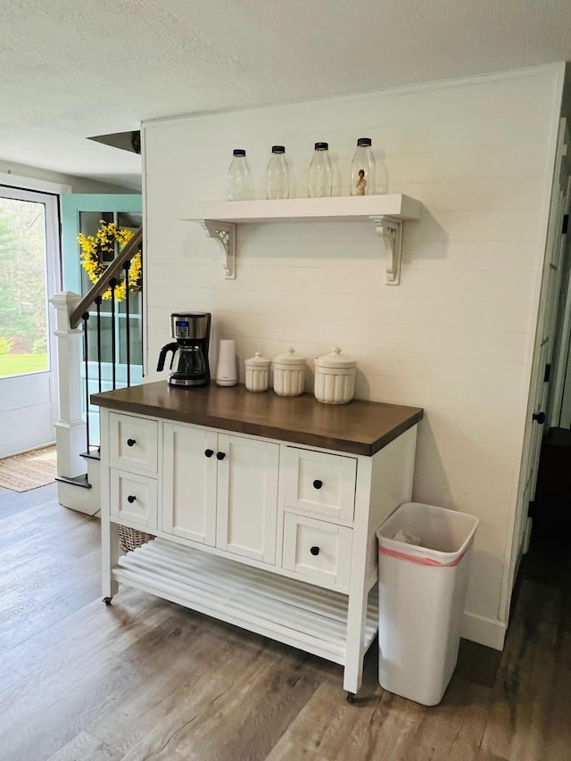 19 Artisan Way, Forestdale, MA 02644 - bar featuring stairway, a textured ceiling, and dark wood-type flooring