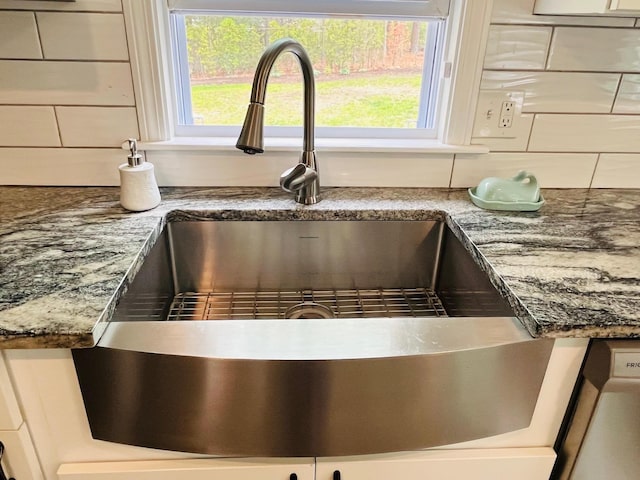 19 Artisan Way, Forestdale, MA 02644 - details featuring decorative backsplash, dark stone counters, and a sink