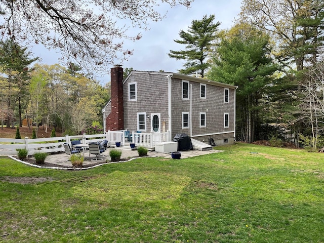 19 Artisan Way, Forestdale, MA 02644 - rear view of property featuring a yard, a wooden deck, a patio, and a chimney
