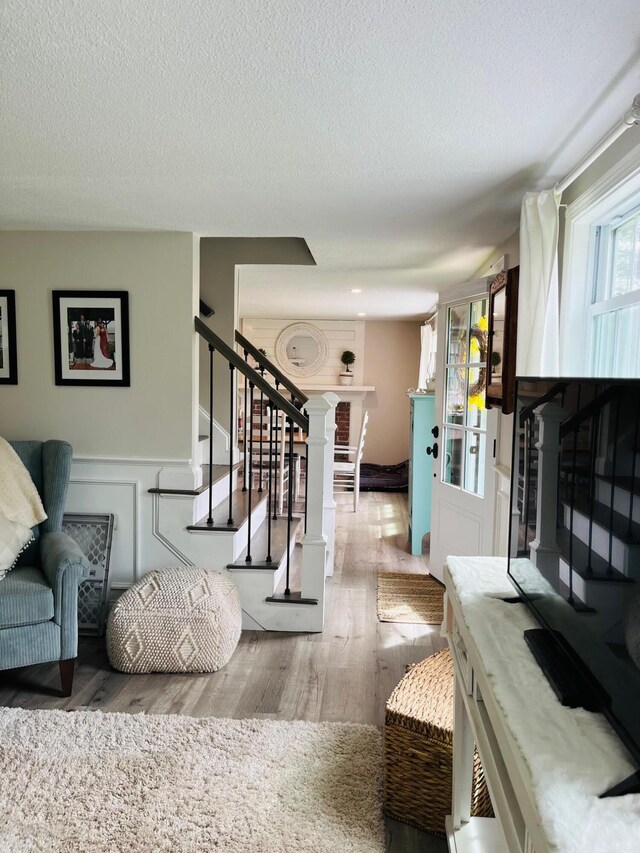 19 Artisan Way, Forestdale, MA 02644 - living room with a textured ceiling, stairway, and wood finished floors