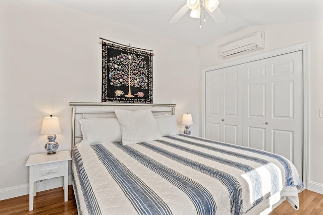 21 Priscilla Alden Rd Ua, Unit Ua, Provincetown, MA 02657 - bedroom featuring lofted ceiling, a wall mounted air conditioner, wood finished floors, and baseboards
