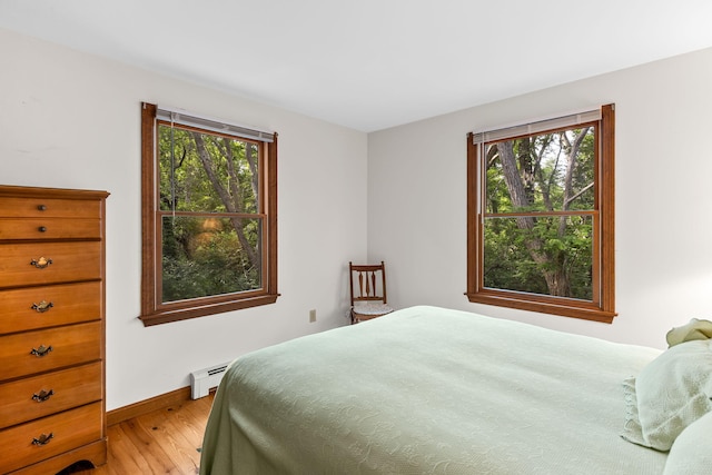 10 Bradford Ln, Eastham, MA 02642 - bedroom with baseboard heating, light wood finished floors, and multiple windows