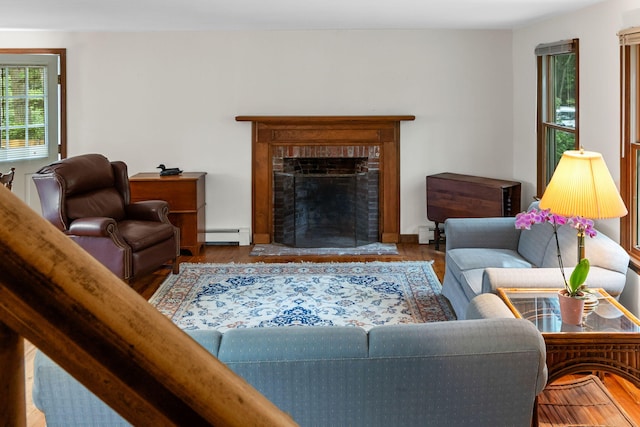 10 Bradford Ln, Eastham, MA 02642 - living room with baseboard heating, a fireplace, and wood finished floors