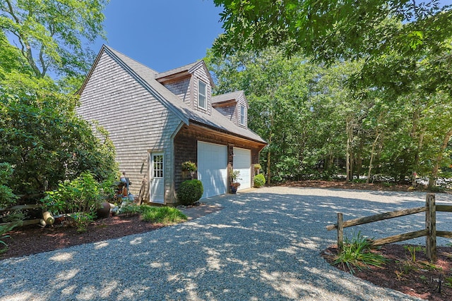 10 Bradford Ln, Eastham, MA 02642 - view of property exterior with driveway and a garage