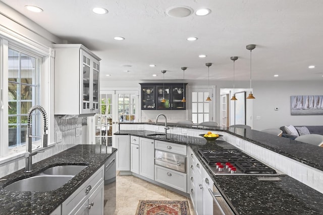 72 River Rd, Marstons Mills, MA 02648 - kitchen with stainless steel appliances, recessed lighting, decorative light fixtures, glass insert cabinets, and a warming drawer