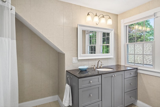 72 River Rd, Marstons Mills, MA 02648 - full bathroom featuring healthy amount of natural light, tile walls, and vanity