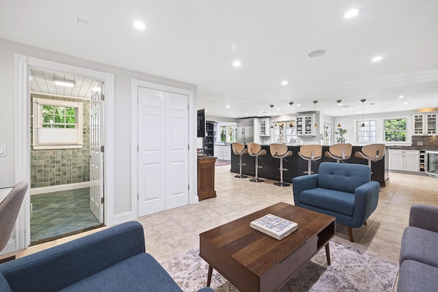 72 River Rd, Marstons Mills, MA 02648 - living room featuring recessed lighting, plenty of natural light, and beverage cooler