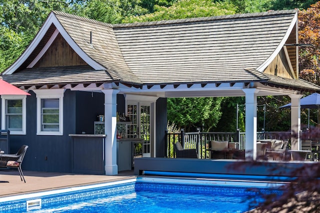72 River Rd, Marstons Mills, MA 02648 - swimming pool featuring an exterior structure, an outbuilding, and a deck