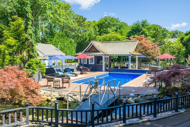 72 River Rd, Marstons Mills, MA 02648 - view of pool with an outbuilding, a storage structure, a patio, and outdoor dining space