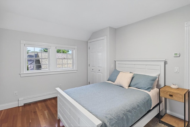 72 River Rd, Marstons Mills, MA 02648 - bedroom with baseboard heating, wood finished floors, and vaulted ceiling